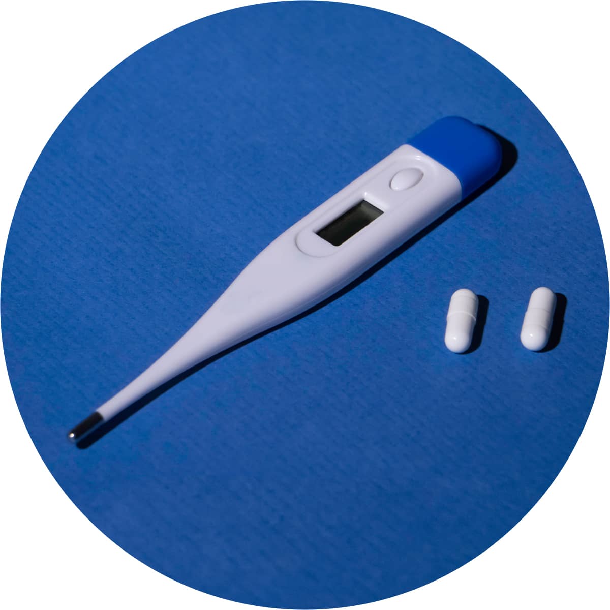 Shop for pain and fever relief products, showing a thermometer and two pain relief capsules 