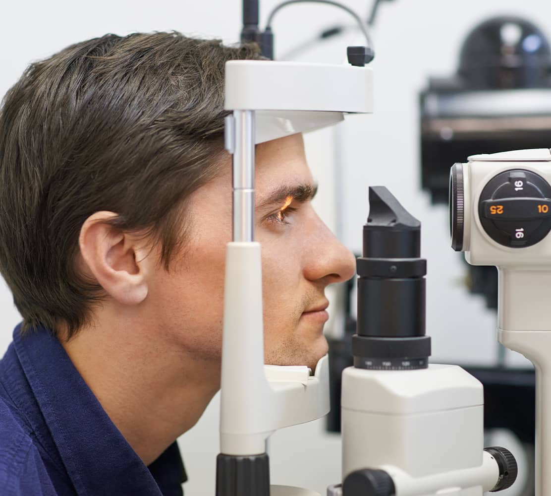 Learn about CVS Optical, showing a young man having an eye exam