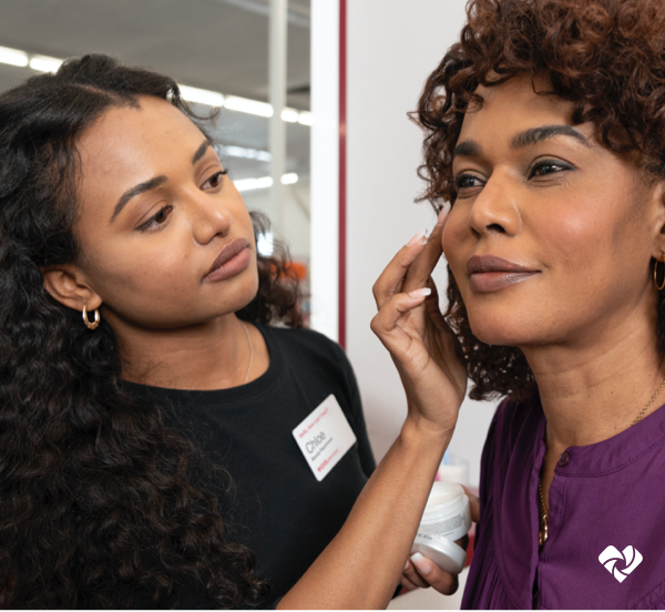 A CVS Beauty customer receiving instruction from a CVS Beauty professional.