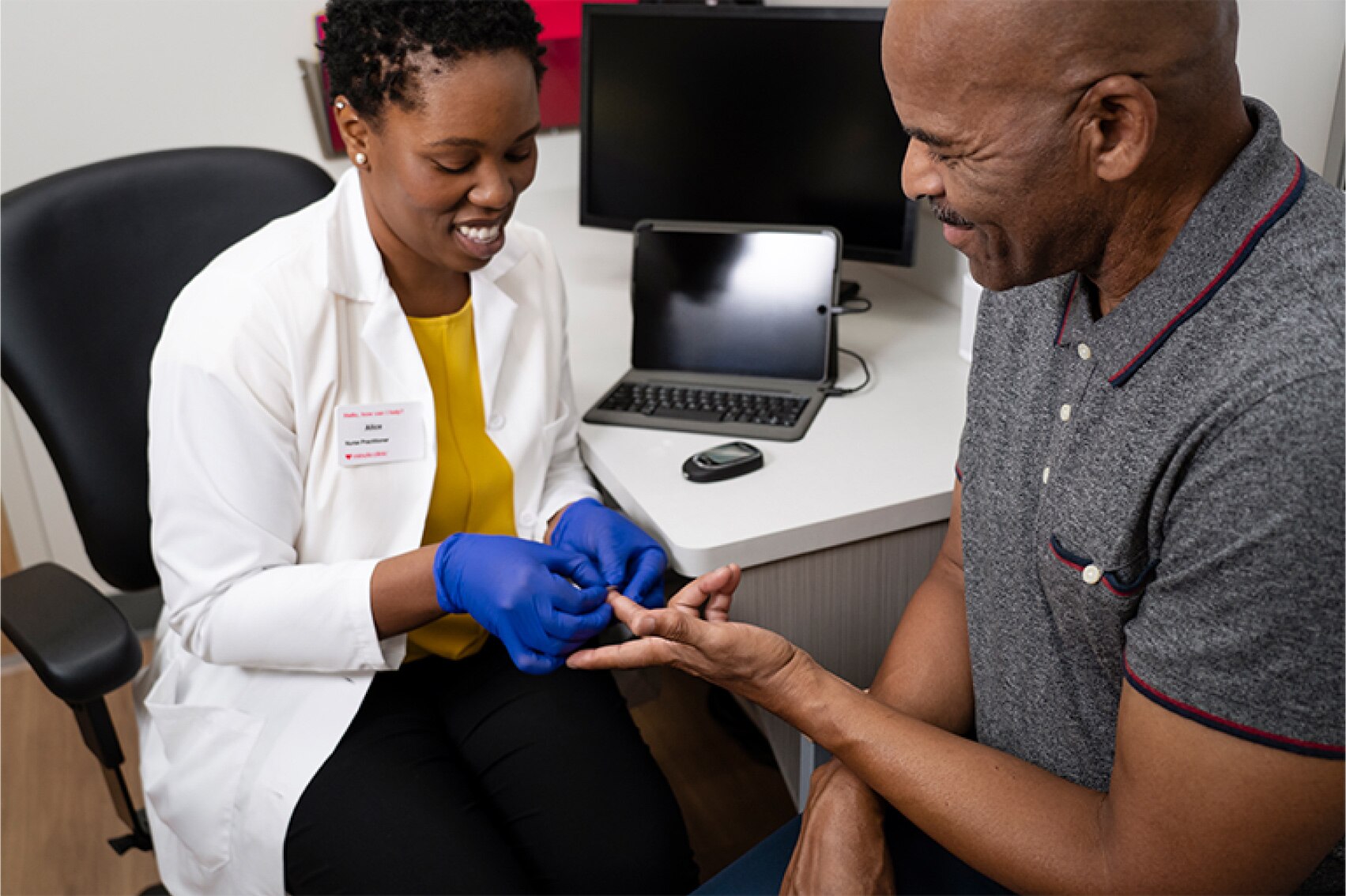 A MinuteClinic provider is putting a bandage on a patient’s finger after obtaining a blood sample for a blood glucose test in a clinical setting.
