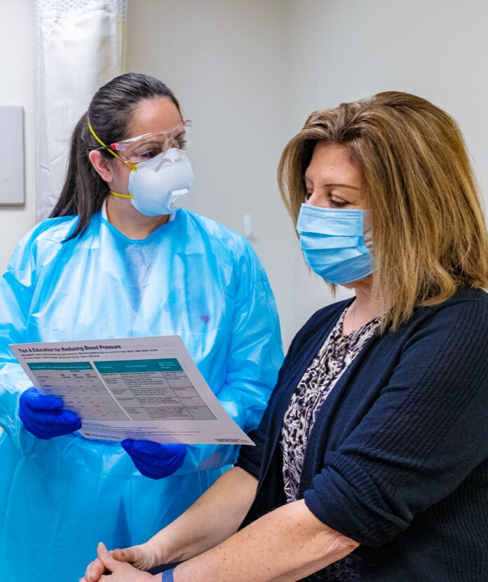 Friendly MinuteClinic provider helping patient