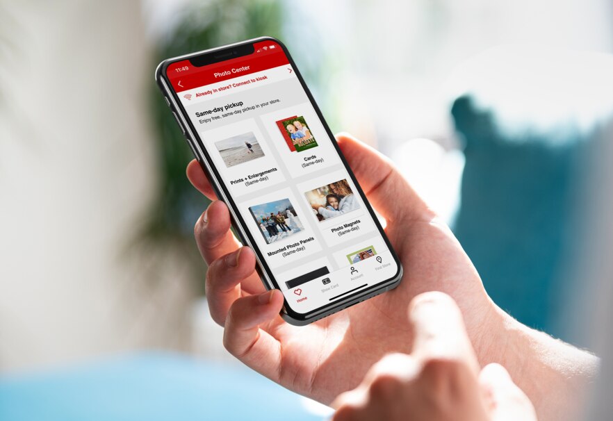 A person browsing through Photo options on the CVS app via a handheld device. Shop Photo now.