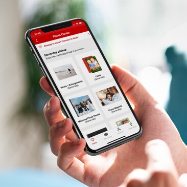 A person browsing through Photo options on the CVS app via a handheld device. Shop Photo now.