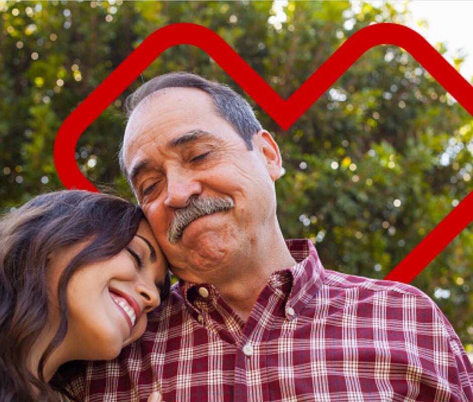 A woman leaning her head on a man's shoulder, with an open CVS heart behind them