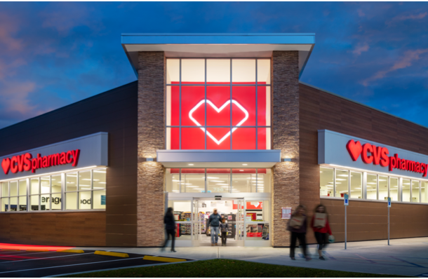 Front of brightly lit CVS store at night