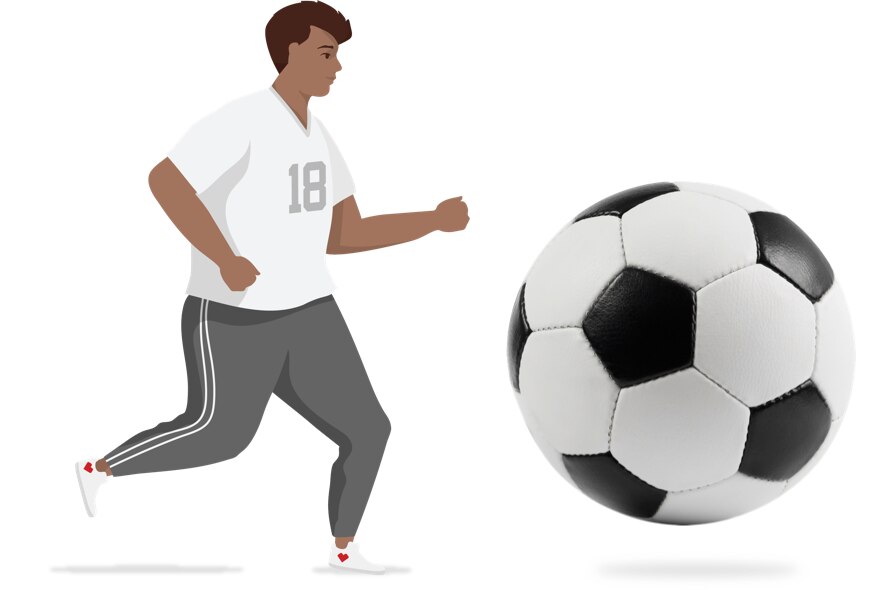 Active man chasing soccer ball