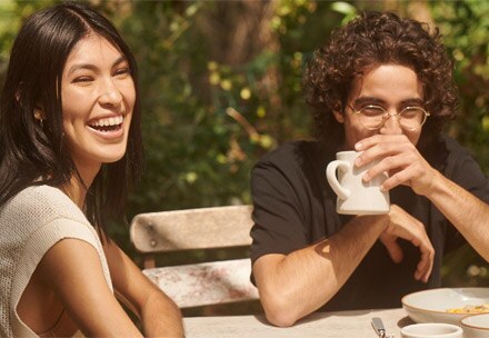 Young couple on a date, enjoying brunch outdoors.