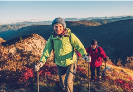 Couple hiking up an Alaskan mountiain