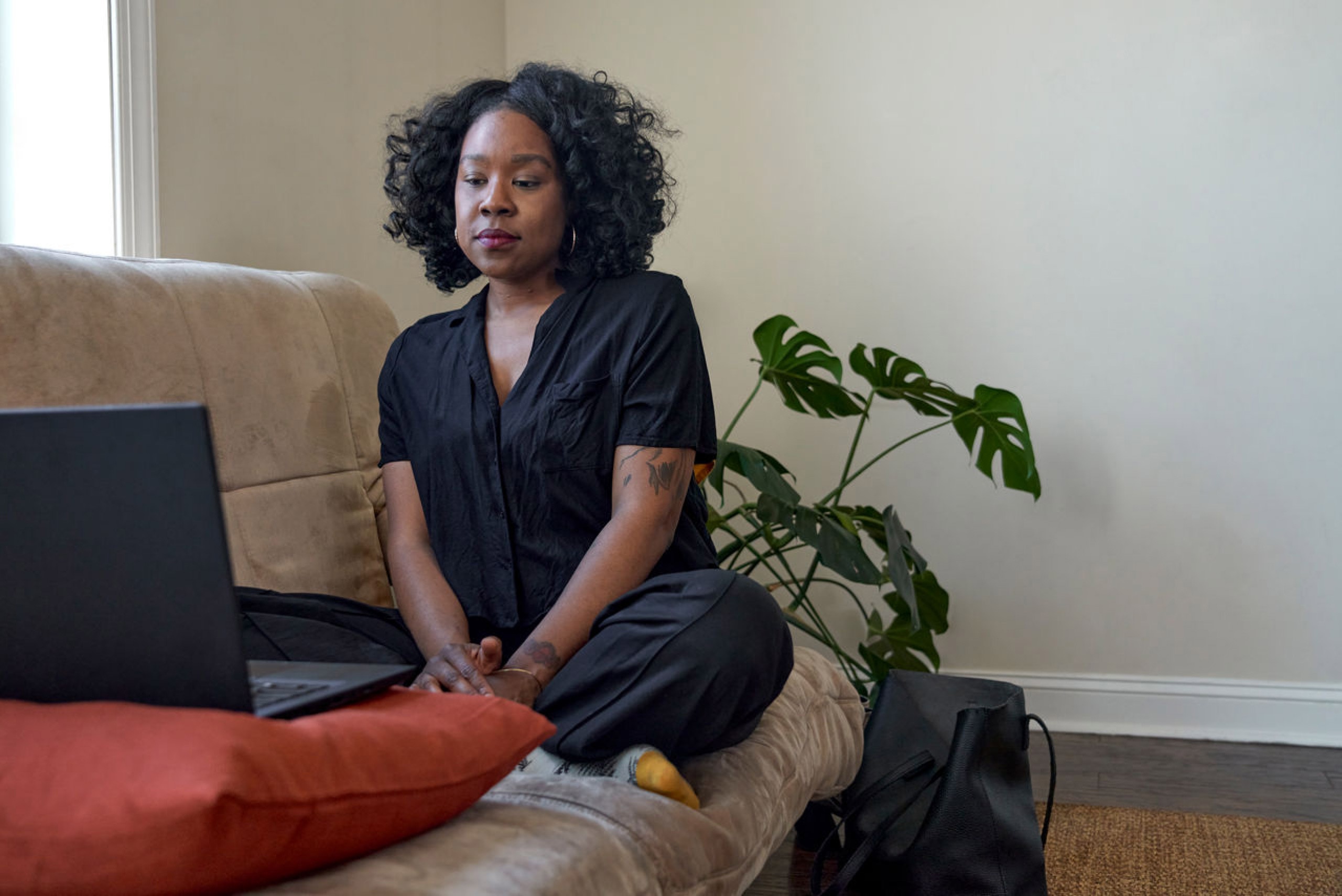 Patient using laptop to have a Virtual Care counseling session with a licensed therapist.