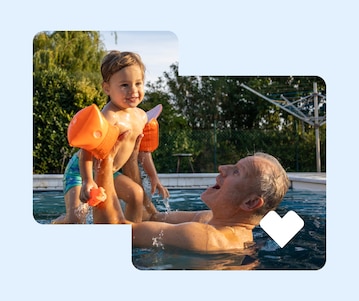 A person picks up their smiling grandchild in a pool.