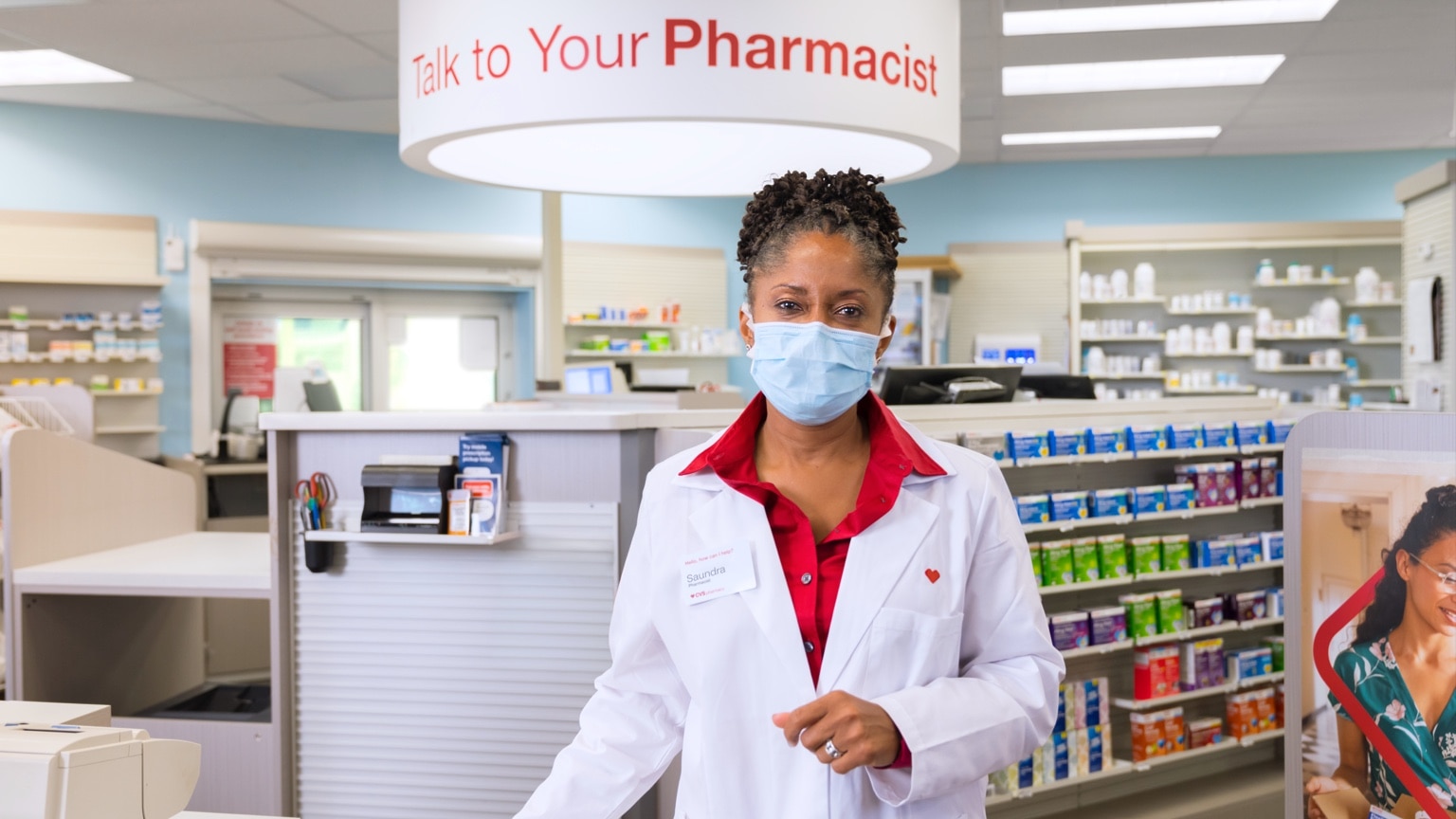 A CVS Pharmacist listens to questions from a patient.