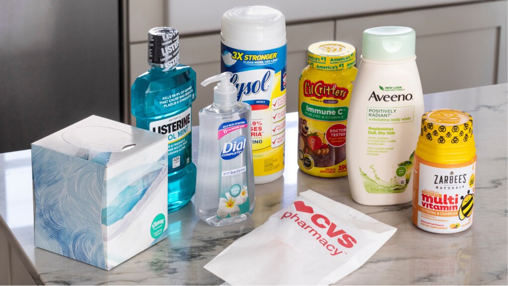 A CVS prescription and an assortment of delivered items sit on a kitchen counter.