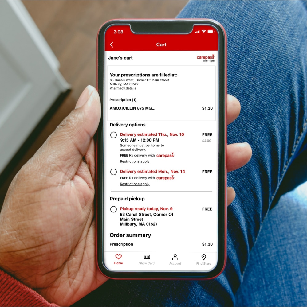 A customer schedules a CVS prescription delivery from her phone.